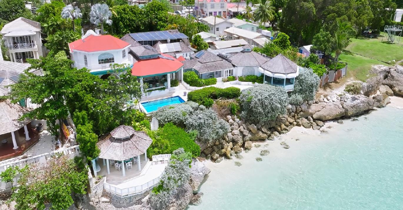 Clifton Cove coastal estate for sale atop coral cliff aerial Caribbean Sea